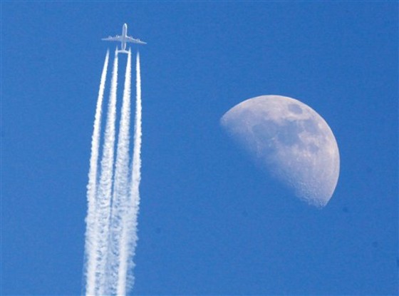 An aircraft passes the moon over Frankfurt, Germany, on April 22 as German air traffic went back to normality following the airspace closure due to the volcanic ash cloud that came from Iceland.